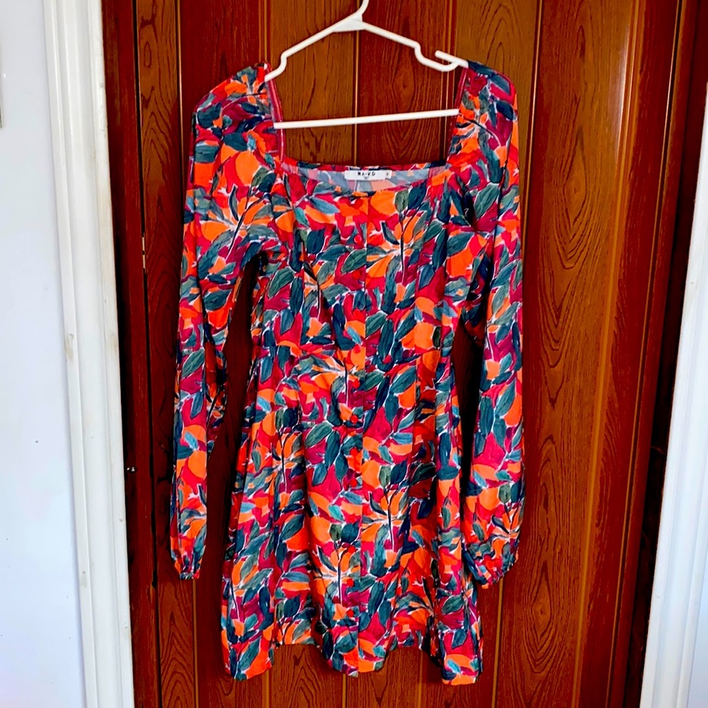 Ladies coral floral colour button up long sleeve dress elastic cuff.